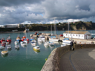 On the path to the pier in Tenby harbour, Croft Court in the distance